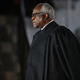 WASHINGTON, DC - OCTOBER 26: Supreme Court Associate Justice Clarence Thomas attends the ceremonial swearing-in ceremony for Amy Coney Barrett to be the U.S. Supreme Court Associate Justice on the South Lawn of the White House on October 26, 2020, in Washington, DC. The Senate confirmed Barrett’s nomination to the Supreme Court today by a vote of 52-48